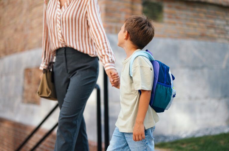 Mother and Son Walking to School on a Sunny Morning
