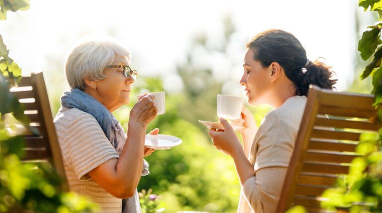 women drinking tea in the garden
