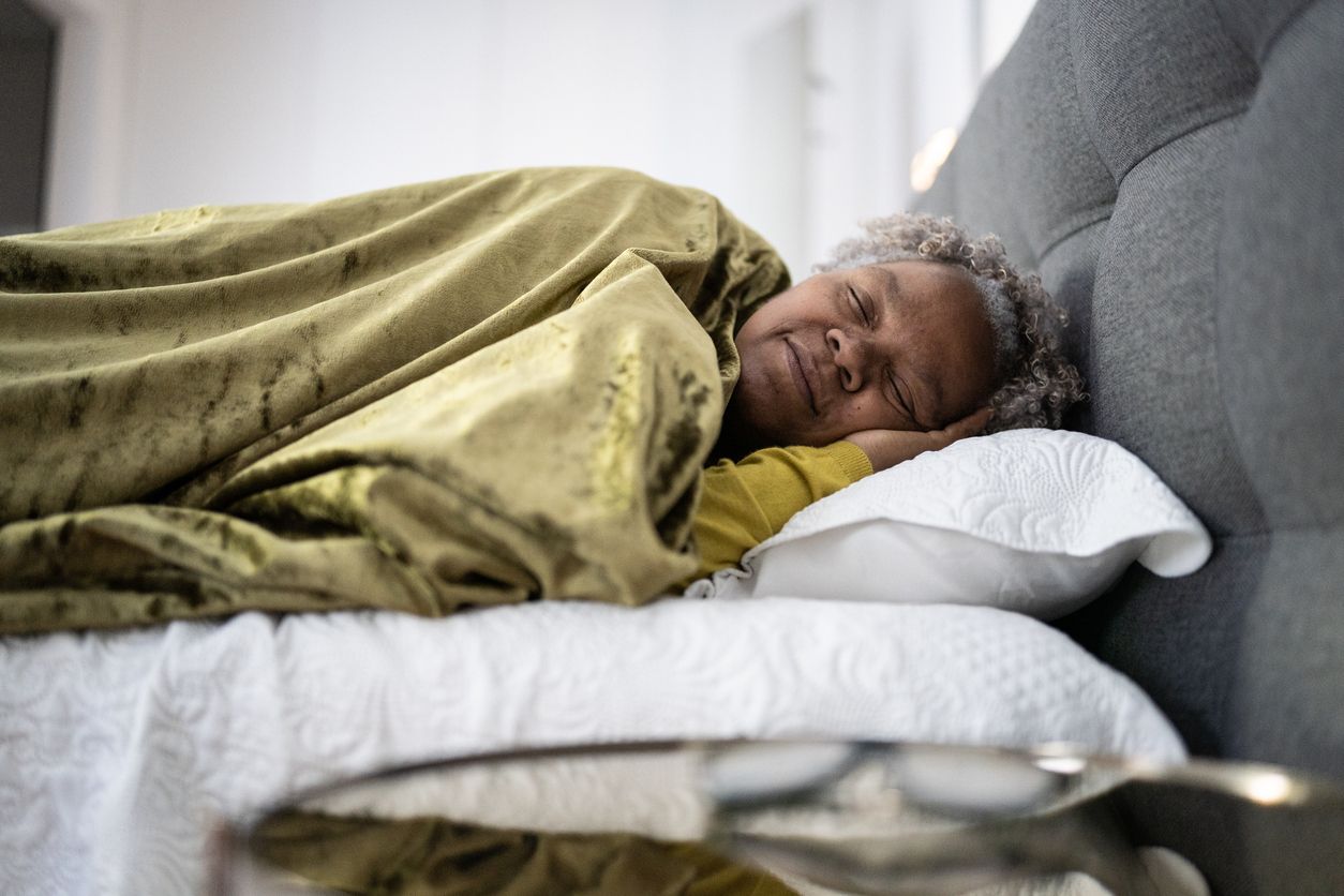 Senior woman sleeping at home